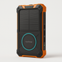 The SolarCharge™ – Power On, Wherever You Go is a rugged black and orange solar power bank with Fast Charge, LED indicators, USB ports, and a wireless charging pad—perfect as a portable outdoor or heavy-duty charger.